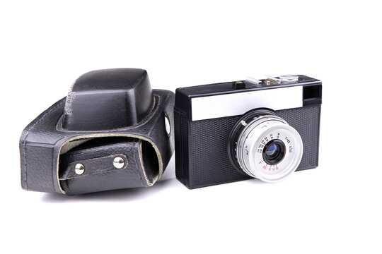 Vintage old photo camera and leather case isolated on a white background. Retro Photo camers Smena 8M made in USSR