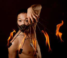 asian man with fire show