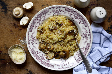 Risotto with mushrooms and cheese. Top view with copy space.