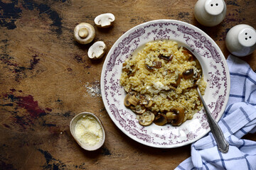 Risotto with mushrooms and cheese. Top view with copy space.