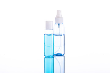 Set of two Personal sanitizer sprayers for disinfection. Protection against viruses, prevention of covid-19 infection. Coronavirus Pandemic Control. Transparent blue alcoholic disinfectant solution.