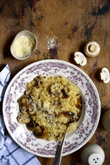 Risotto with mushrooms and cheese. Top view with copy space.