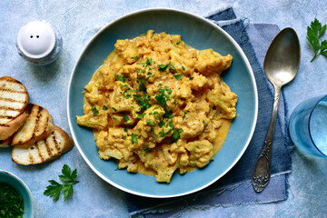 Vegan cauliflower curry. Top view with copy space.