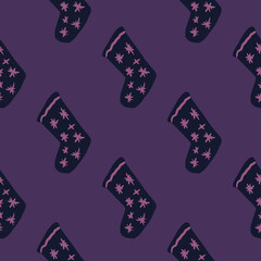 Seamless pattern with christmas socks doodle elements. Purple background. New year holiday backdrop.
