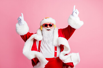 Photo of crazy funky santa claus enjoy listen x-mas christmas fairy jolly radio headphones raise...