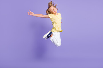 Obraz premium Full body photo of carefree boy jump up wear casual style clothes isolated over violet color background