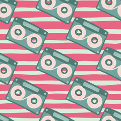 Soft tones cassette seamless pattern. Hand drawn music elements in pastel palette on pink stripped background.