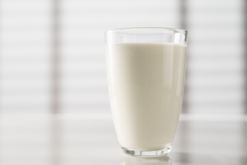 Glass of milk on the kitchen table