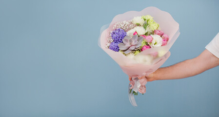 Delivery man with bouquet flowers