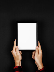 Photo frame in hands on a black background. Preparation for text, mockup, copy space.