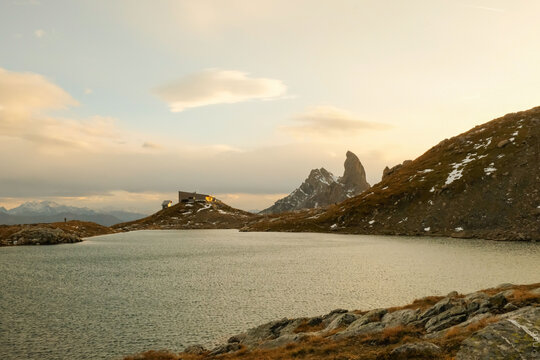 Pierra menta over the Presset lake at sunset with clouds