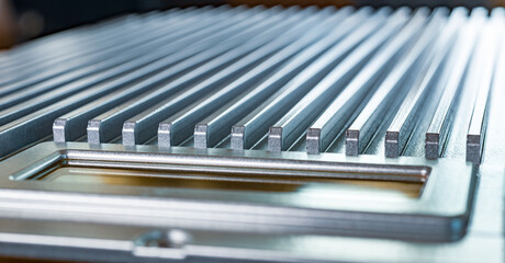 Fluted metal surface next to a control panel