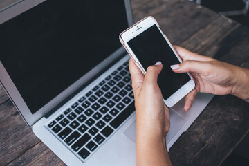 Unrecognizable woman browsing mobile phone