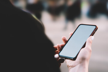 Anonymous woman checking mobile phone