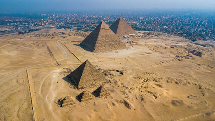 Historical Giza pyramids in Egypt shot by drone. - obrazy, fototapety, plakaty