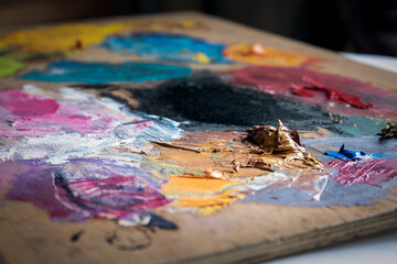 Fototapeta premium Artist's color palette. Dried oil paint. Creativity and art