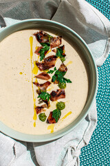 Cauliflower soup with bacon and basil