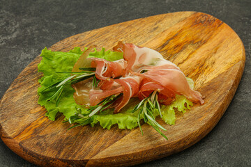 Sliced pork Jamon with rosemary