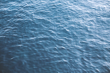  Closeup of calm surface of river water with water in blue.