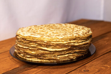 Zucchini pancakes on a wooden table.