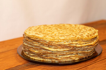 Zucchini pancakes on a wooden table.