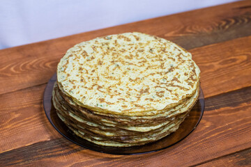 Zucchini pancakes on a wooden table.