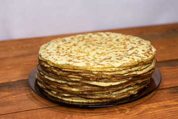 Zucchini pancakes on a wooden table.