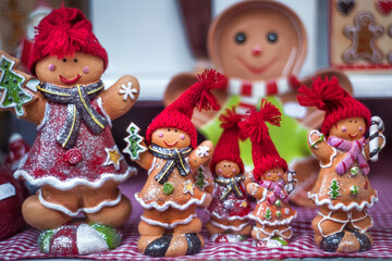 Gingerbread, candies and nuts displayed on a Christmas market stall in Strasbourg, Alsace, France. Ceramic decorations on christmas and new year market. Christmas atmosphere