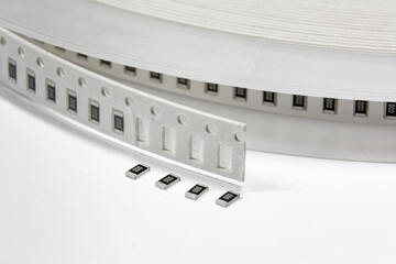 Close-up of tape with surface mount electronics components - resistors