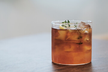A glass of ice black tea in cafe