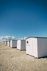 White beach huts at the North Sea, vintage processing added