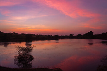 Obraz premium Reflection of clouds in the lake water during sunset