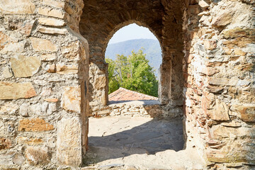 Orthodox church in Jvari Monastery located near Mtskheta, Georgia. Old house built of yellow stones and bricks.