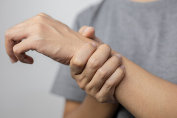 Woman suffering from pain in wrist.