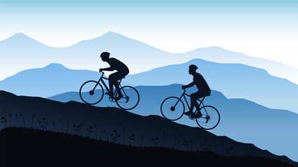 Fototapeta premium Silhouette of cyclists on the mountain