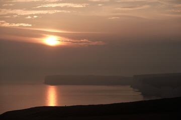 Sunset over the Seven Sisters chalk cliffs in East Sussex, UK