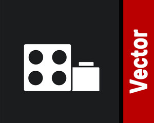 White Toy building block bricks for children icon isolated on black background. Vector.