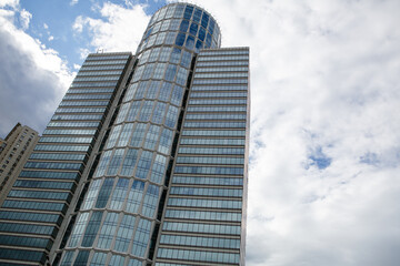 Fototapeta na wymiar Modern multi-storey building against the sky