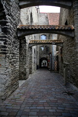 St. Catherine's Passage with two people silhouettes, Old Town, Tallinn, Estonia