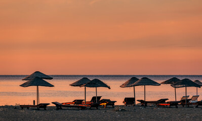 Beach umbrellas at sunrise