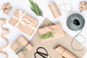 Eco friendly alternative green Xmas gifts wrapped with recycled craft paper and natural elements