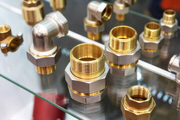Bronze fittings for water systems. Sale of equipment in a plumbing store. Close-up