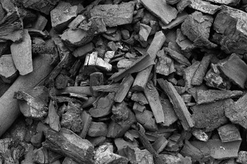 Black charcoal texture background.