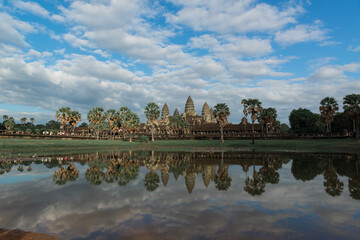 Fototapeta premium Front side of the main complex of Angkor Wat temple, reflected on the water surface, Siem Reap, Cambodia.