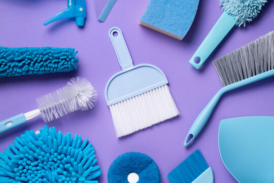 Blue house cleaning product on purple background, housekeeping and housework concept