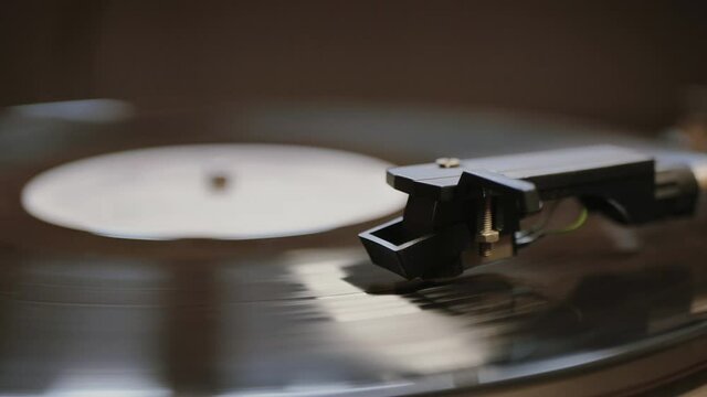 Cinemagraph vinyl record is spinning. Old retro turntable.turntable stylus on a record