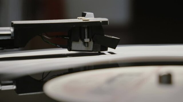Vinyl record is spinning. Old retro turntable.Turntable stylus on a record