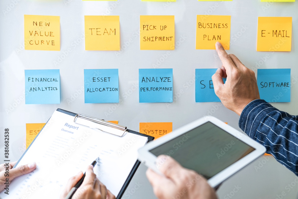 Aufkleber two creative business people meeting and planning use post it notes sticky note on board to share id