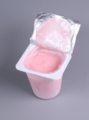 pink yogurt on gray