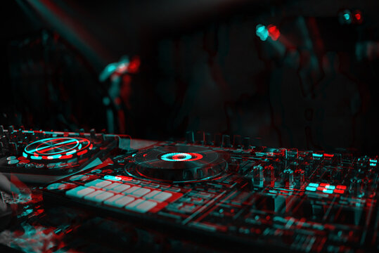 DJ Console For Mixing Music With Blurry People Dancing At A Nightclub Party. Black And White With 3D Glitch Virtual Reality Effect